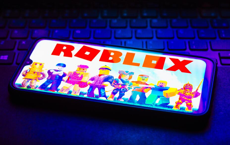In this photo illustration the Roblox logo seen displayed on a smartphone.