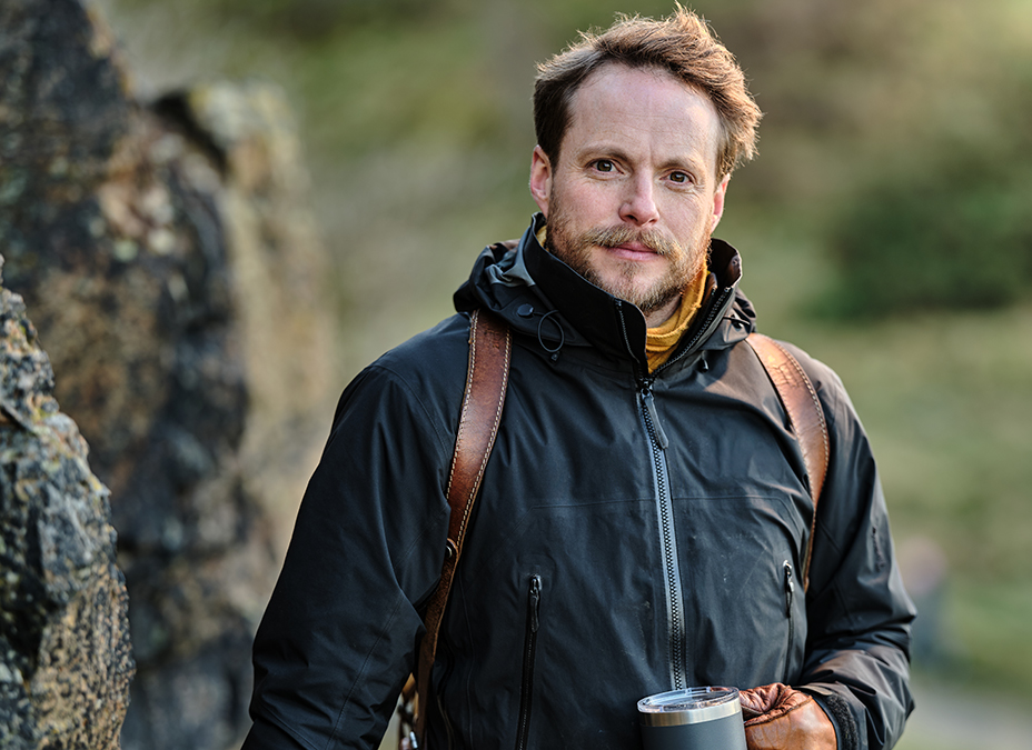 Peter Singlehurst standing in an outdoor jacket in the countryside