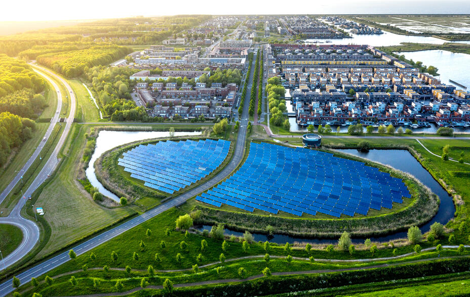 Modern sustainable neighbourhood in Almere, The Netherlands. The city heating (stadswarmte) in the district is partially powered by a solar panel island (Zoneiland). Aerial view.
