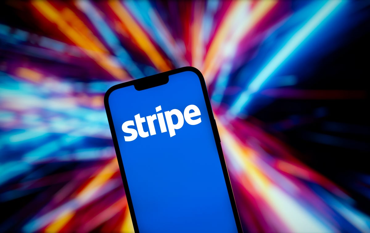 Phone with Stripe logo, colourful background 