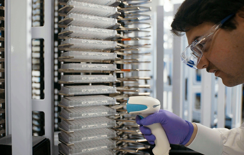 Guardant health care researcher conducting an equipment check in the laboratory.