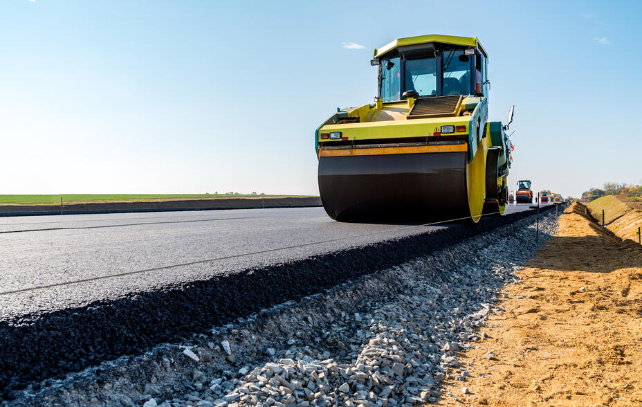 Road rollers building the new asphalt road